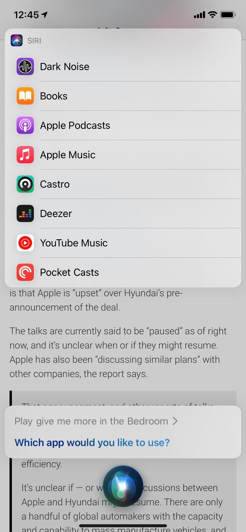 Uno screenshot dell'interfaccia Siri in iOS 14.5 che chiede all'utente di scegliere l'app predefinita per lo streaming di musica